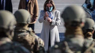U.S. House Speaker Nancy Pelosi, D-Calif., meets with a National Guard troop, on the East Entrance of the US Capitol in Washington, DC, on January 13, 2021.