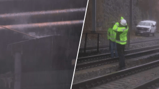 A smoking electrical transformer and a worker inspecting the fire at the MBTA Commuter Rail Hyde Park on Monday, March 24, 2025.