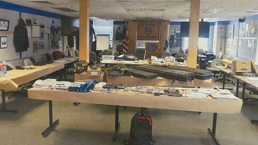 This photo shows guns, drugs, cash, credit cards, checks and identity documents seized as part of a Quincy Police Department investigation.